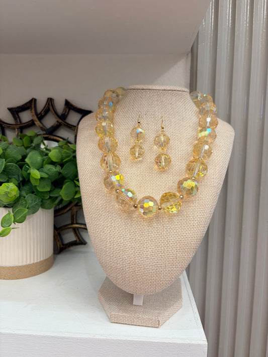 Round “Crystals” set with gold color accent beads (16” long + 2” extender)